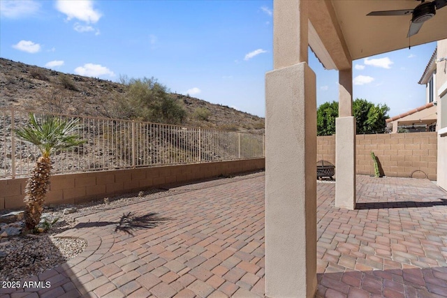 421 W Mountain Sage Dr, Phoenix, AZ 85045 - fenced backyard featuring ceiling fan and a patio