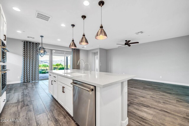 unfurnished dining area with recessed lighting, visible vents, wood finished floors, baseboards, and ceiling fan with notable chandelier