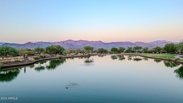 drone / aerial view featuring a residential view and a water and mountain view