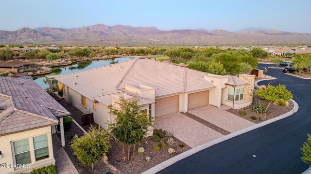 aerial view at dusk with a residential view and a mountain view