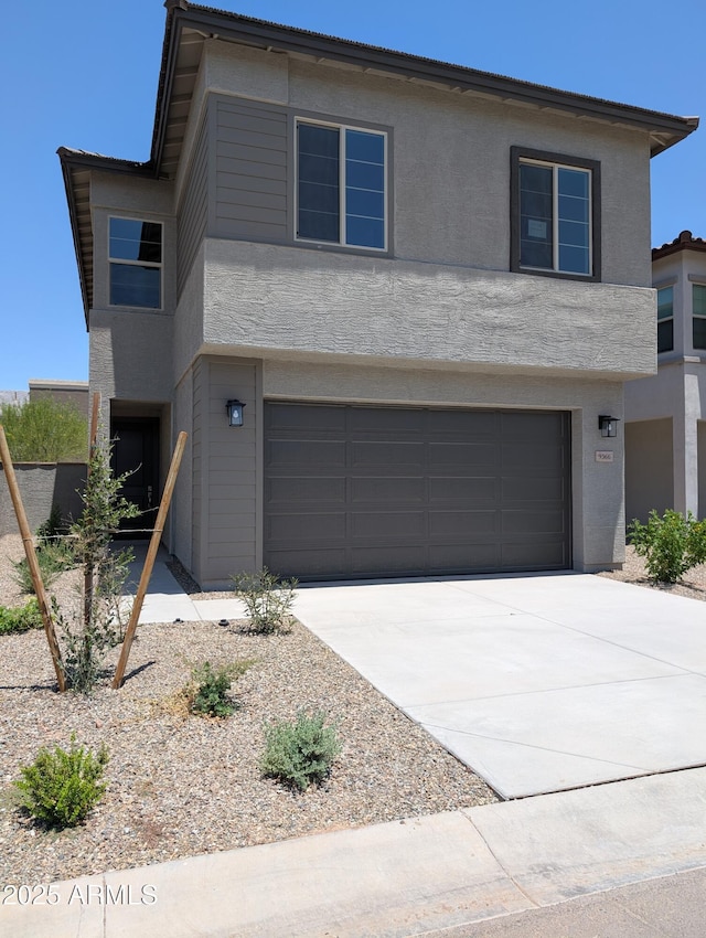 9366 E Sequence Ave, Mesa, AZ 85212 - view of front of property with an attached garage, concrete driveway, and stucco siding