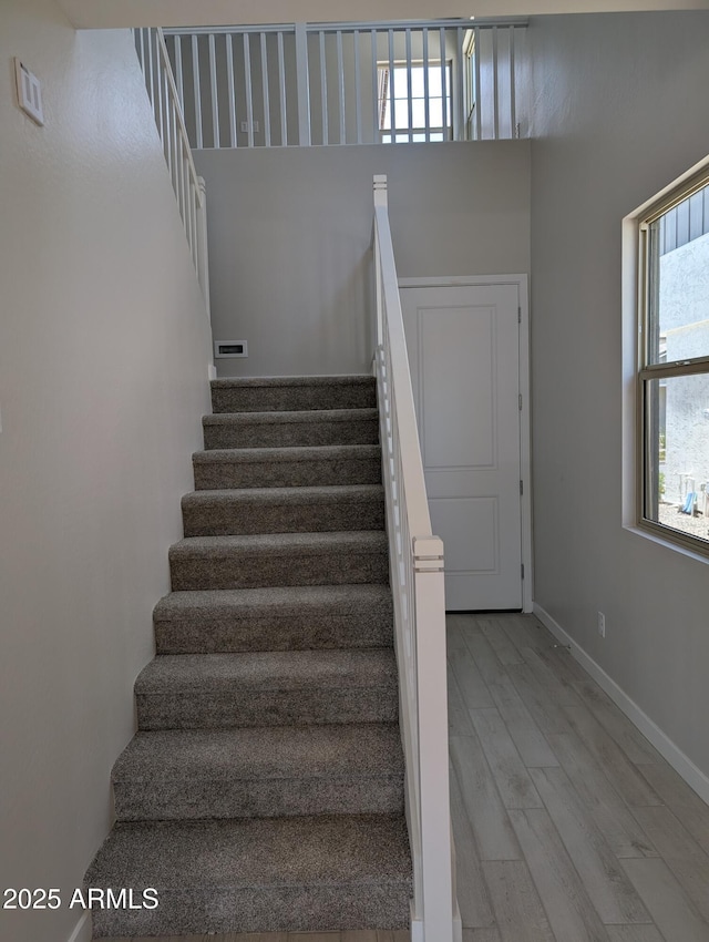 9366 E Sequence Ave, Mesa, AZ 85212 - staircase featuring wood finished floors and a high ceiling