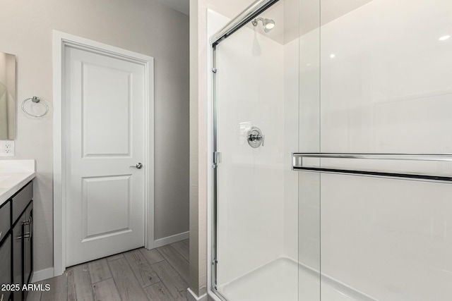 9366 E Sequence Ave, Mesa, AZ 85212 - full bathroom featuring wood finished floors, a stall shower, and vanity
