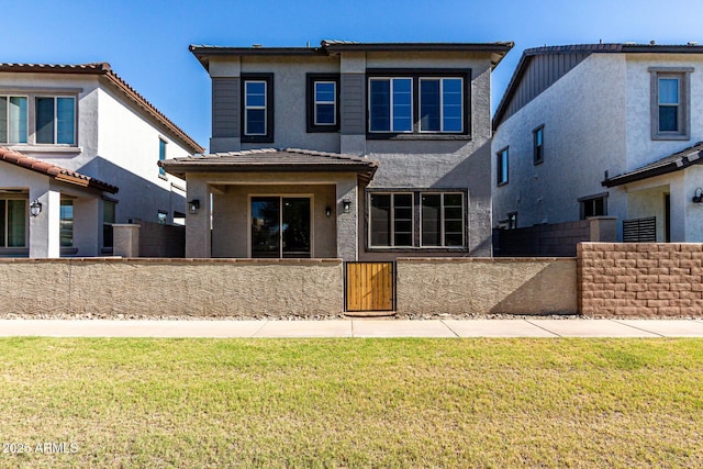 9366 E Sequence Ave, Mesa, AZ 85212 - back of property featuring a fenced front yard, stucco siding, and a gate