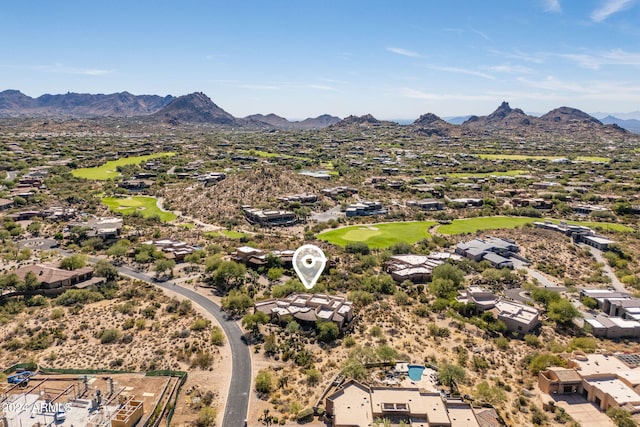 birds eye view of property with a mountain view