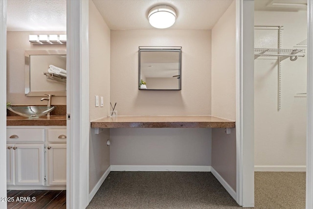 bathroom with vanity and a textured ceiling