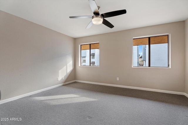 unfurnished room featuring carpet and ceiling fan