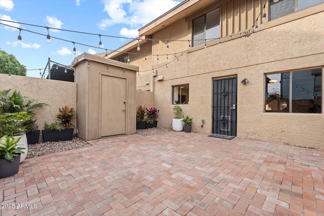 view of patio with a shed