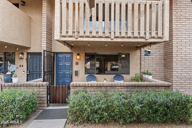 entrance to property with a balcony