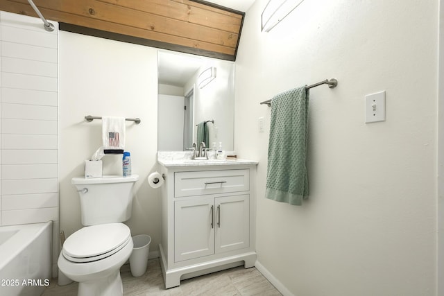 full bathroom with baseboards, toilet, bathtub / shower combination, and vanity