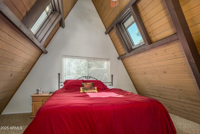 carpeted bedroom with lofted ceiling with beams