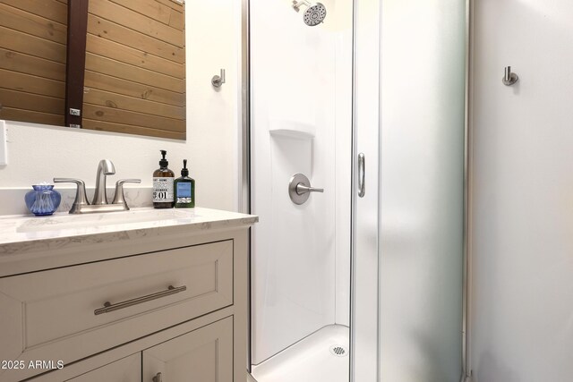 bathroom with vanity and a stall shower