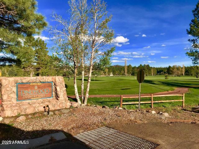 view of property's community with a lawn