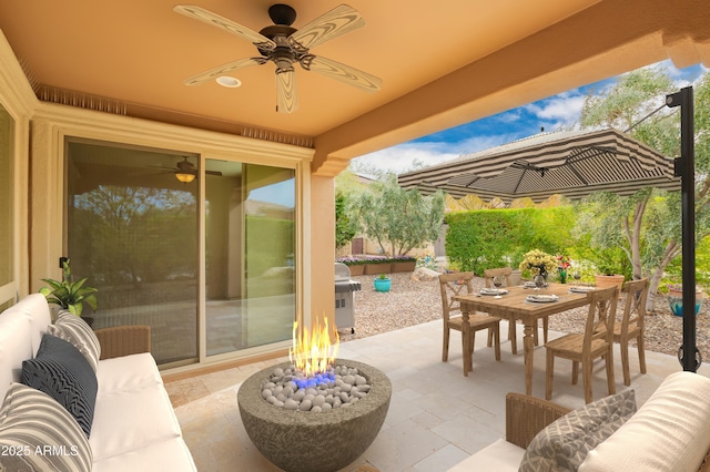 view of patio / terrace with outdoor dining area, an outdoor living space with a fire pit, a grill, and ceiling fan