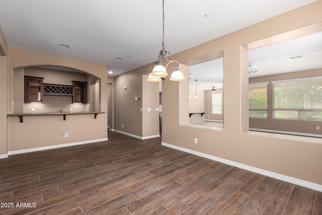 unfurnished living room with wood finish floors, recessed lighting, visible vents, ceiling fan, and baseboards