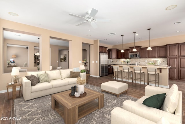 living room featuring recessed lighting, visible vents, a ceiling fan, baseboards, and dark wood-style floors