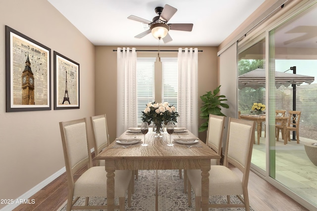 dining area featuring ceiling fan, baseboards, and wood finished floors