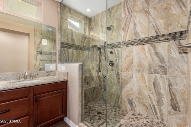 bathroom featuring vanity and a walk in shower