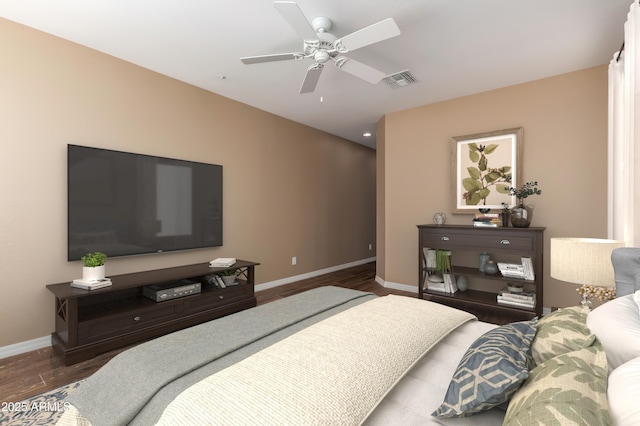 bedroom featuring a ceiling fan, wood finished floors, visible vents, and baseboards