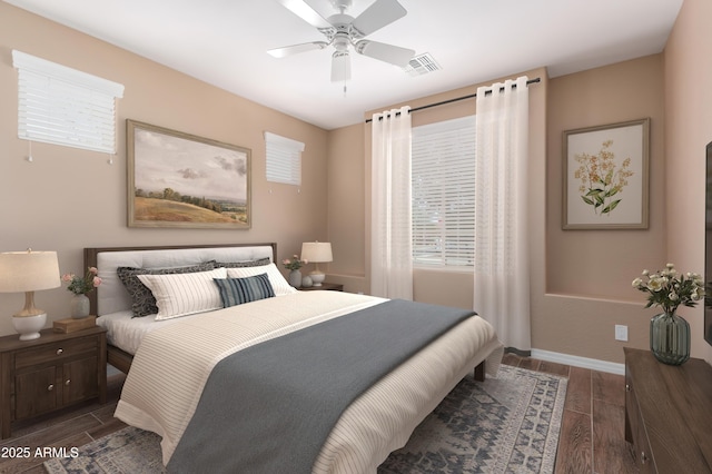 bedroom with a ceiling fan, visible vents, baseboards, and wood finished floors