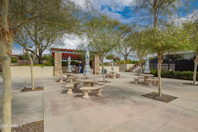 view of patio featuring fence