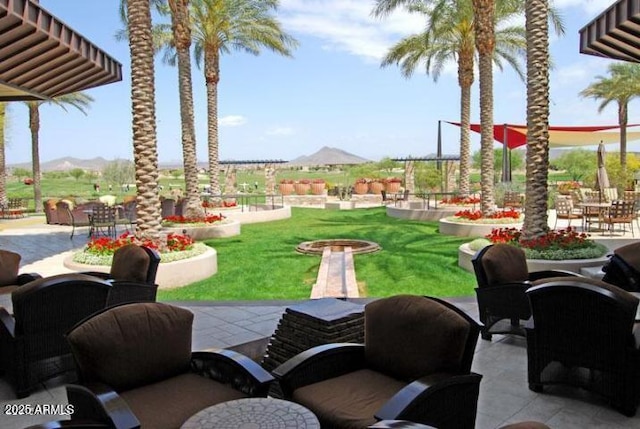 view of patio / terrace featuring a mountain view