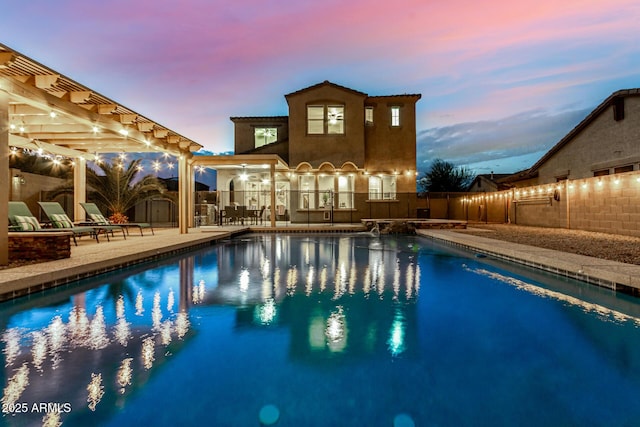 view of swimming pool with a storage shed, a patio, a fenced in pool, a fenced backyard, and an outdoor structure