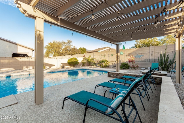 view of swimming pool featuring a fenced backyard, a patio, and a fenced in pool