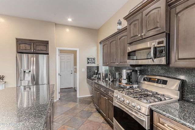kitchen featuring tasteful backsplash, appliances with stainless steel finishes, and dark brown cabinetry