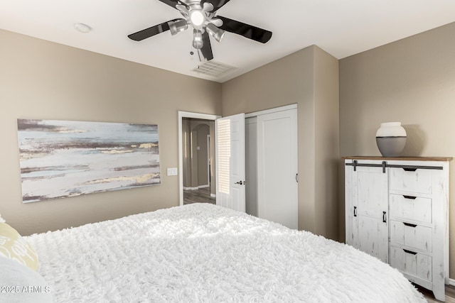 bedroom with a ceiling fan, a closet, and visible vents