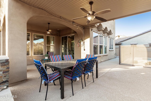 view of patio featuring a ceiling fan and outdoor dining space