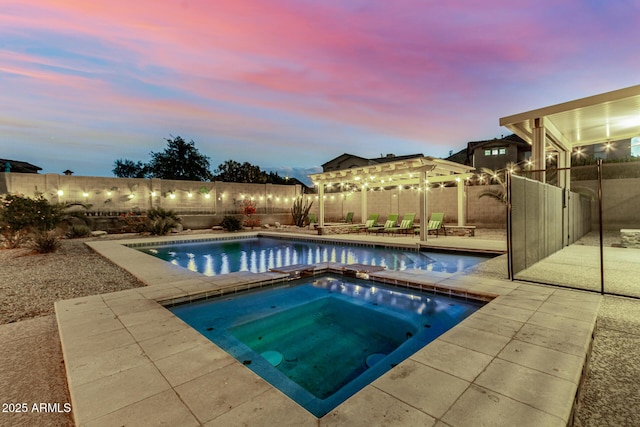 view of swimming pool with a fenced backyard, an in ground hot tub, a patio, and a fenced in pool