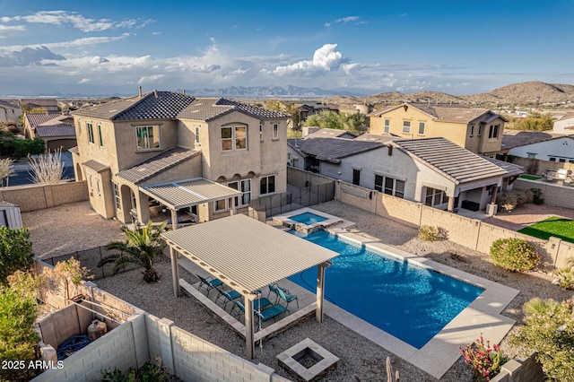 view of swimming pool with a fenced backyard, a residential view, and a patio area