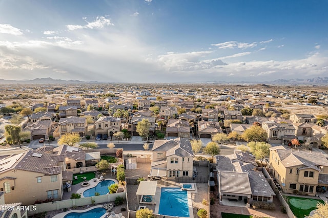 birds eye view of property with a residential view