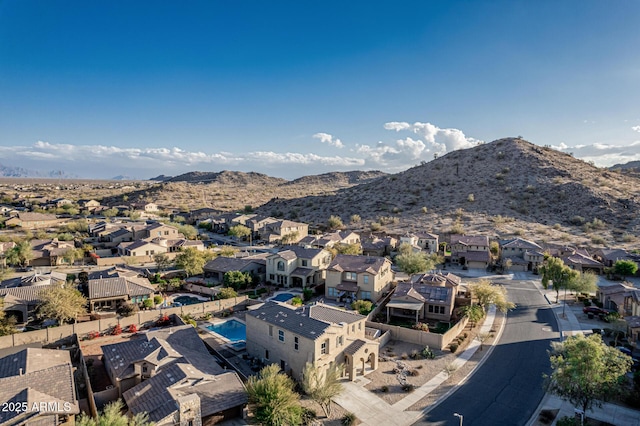 drone / aerial view featuring a mountain view and a residential view