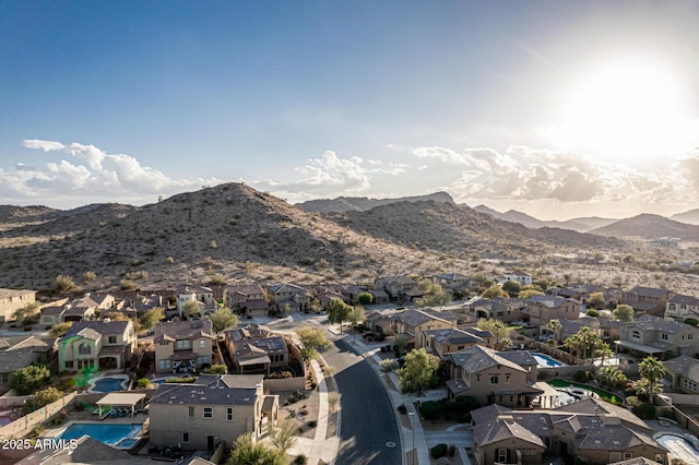 birds eye view of property with a residential view and a mountain view