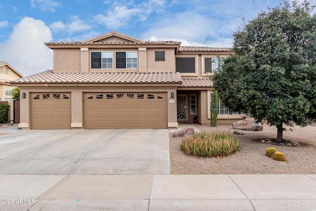 mediterranean / spanish-style home with a garage