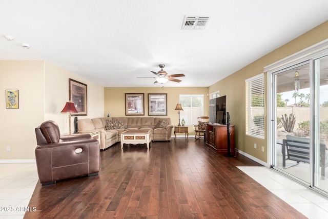 living room featuring hardwood / wood-style flooring and ceiling fan