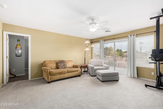 living room with ceiling fan and carpet flooring