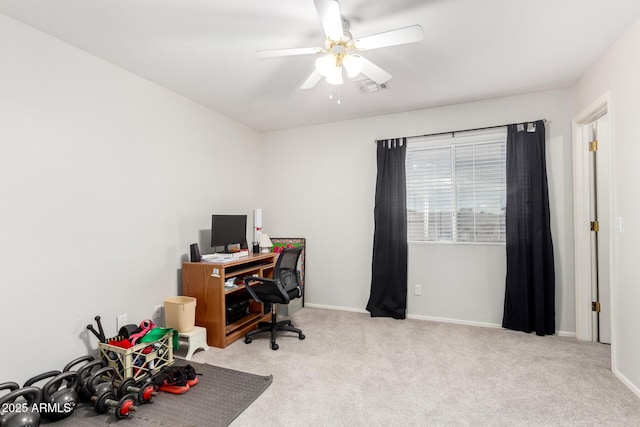 office area featuring ceiling fan and light carpet