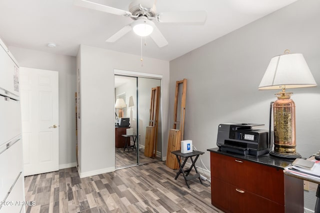 office with ceiling fan and wood-type flooring