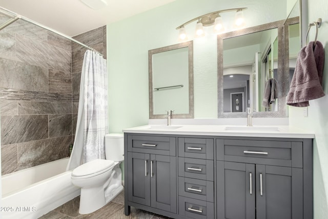 full bathroom with vanity, toilet, and shower / bath combo with shower curtain