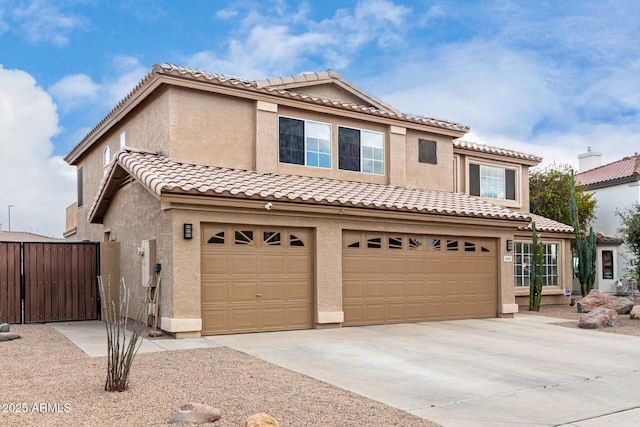 mediterranean / spanish house featuring a garage