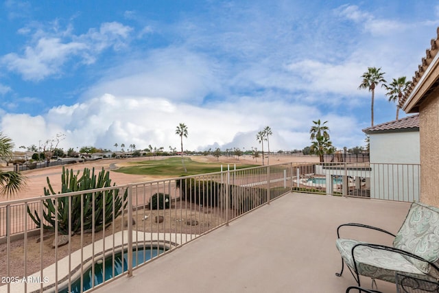 view of patio / terrace with a fenced in pool