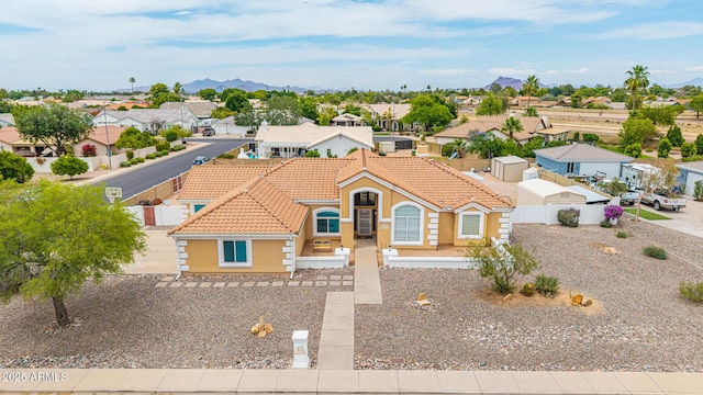4622 E Ellis Cir, Mesa, AZ 85205 - mediterranean / spanish-style house with a tiled roof, a residential view, a mountain view, and stucco siding