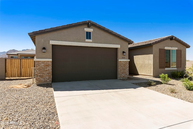 ranch-style home featuring a garage