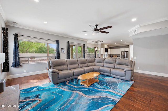living room with hardwood / wood-style floors, ornamental molding, baseboards, and ceiling fan