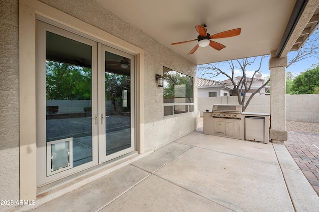 view of patio / terrace with fence, french doors, grilling area, and a ceiling fan