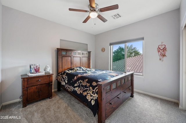 bedroom featuring baseboards, visible vents, a ceiling fan, and light carpet
