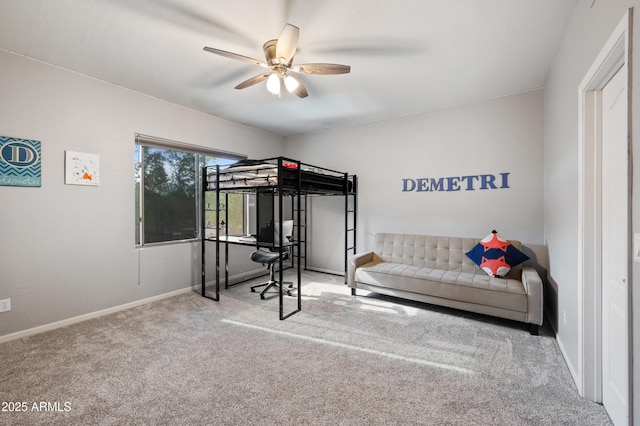 carpeted bedroom with baseboards and ceiling fan